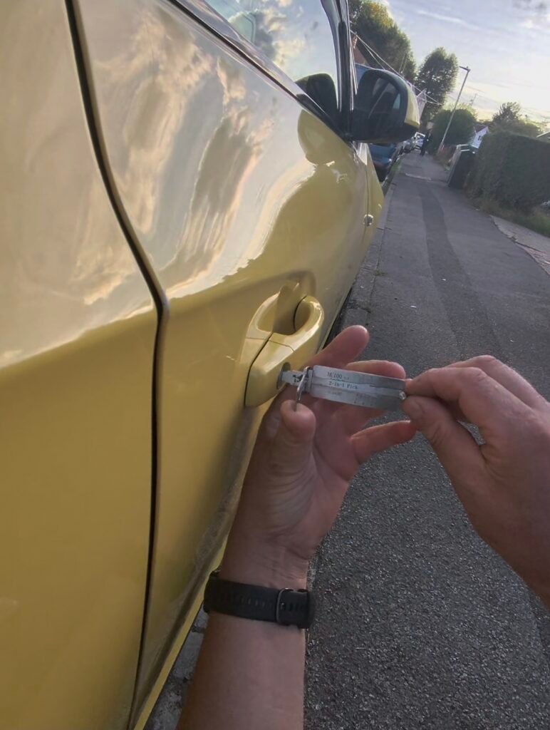 Replacement key for a 2016 Vauxhall Astra GTC held at the driver door